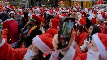 Thousands of Santas and a Few Grinches Hit the Streets for Annual SantaCon Bar Crawls 